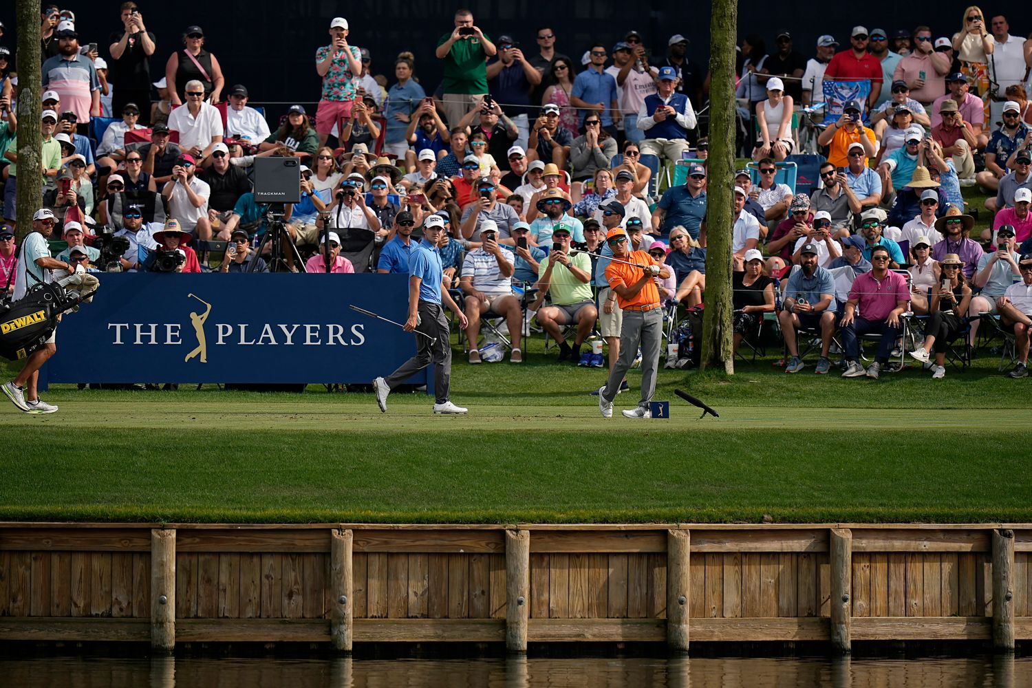 Rickie Fowler hits from the 17th hole in the 2023 Players Championship.